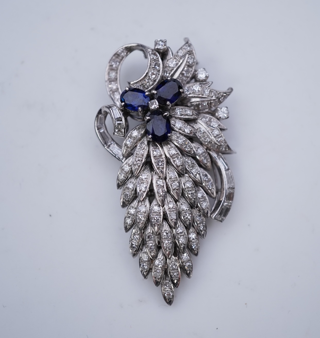 A sapphire and diamond brooch, mid 20th century